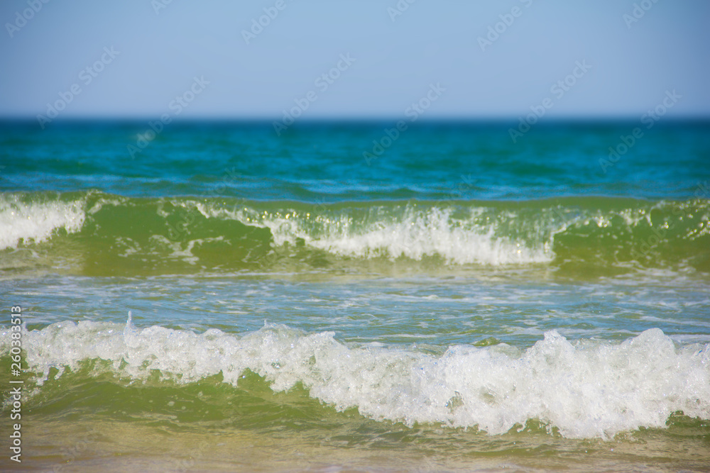 Sea waves and sandy beach Sea waves and sandy beach