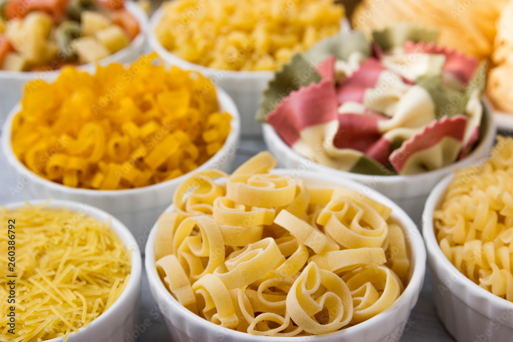 Different of types and shapes of dry Italian  of pasta.