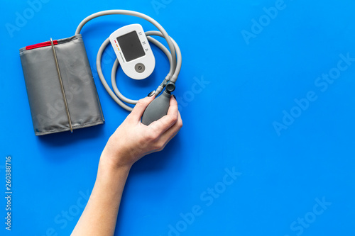 cardiologist work desk with pulsimeter on blue background top view mockup photo