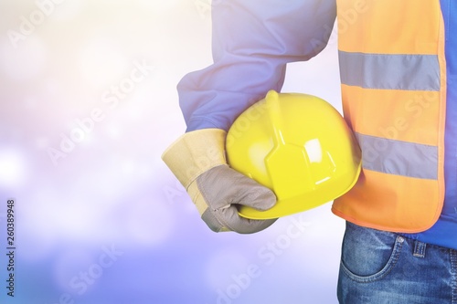 Worker man with helmet on background photo