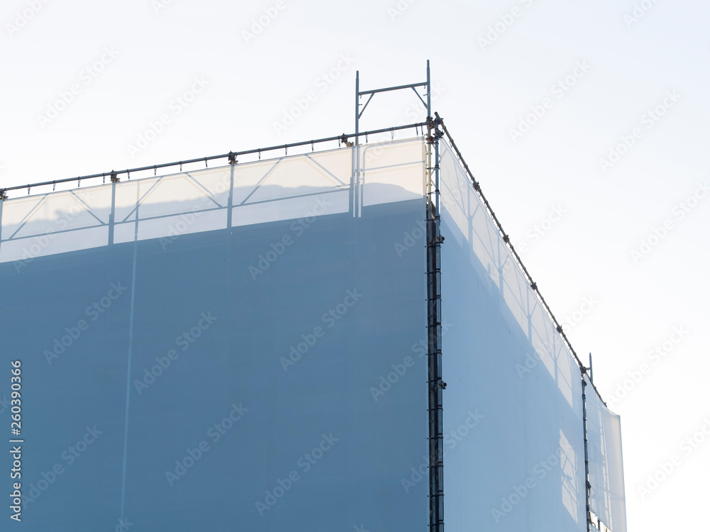 covered scaffholding protects a building under restoration covered scaffholding protects a building under restoration