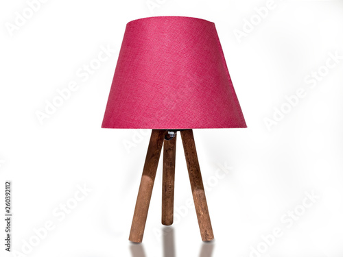 pink lampshade with wooden legs. pink colored night light