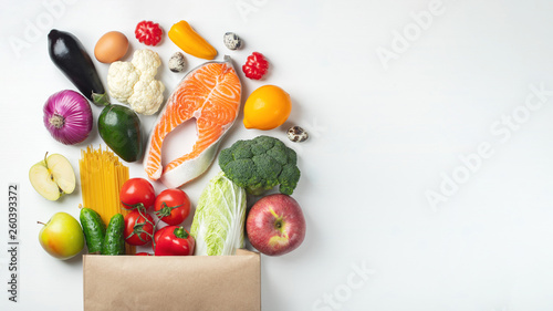 Supermarket. Paper bag full of healthy food.