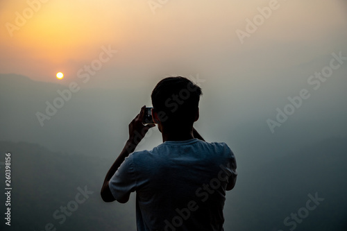 Photography man taking pictures on mobile phone