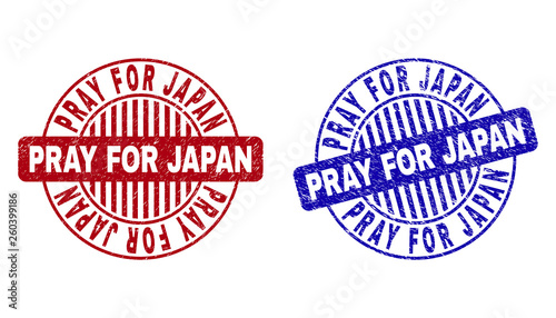 Grunge PRAY FOR JAPAN round stamp seals isolated on a white background. Round seals with distress texture in red and blue colors.