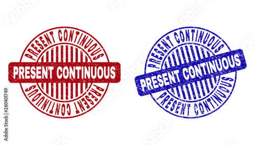 Grunge PRESENT CONTINUOUS round stamp seals isolated on a white background. Round seals with grunge texture in red and blue colors.