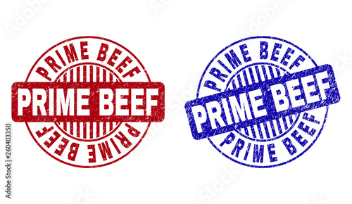 Grunge PRIME BEEF round stamp seals isolated on a white background. Round seals with grunge texture in red and blue colors. Vector rubber imitation of PRIME BEEF tag inside circle form with stripes.