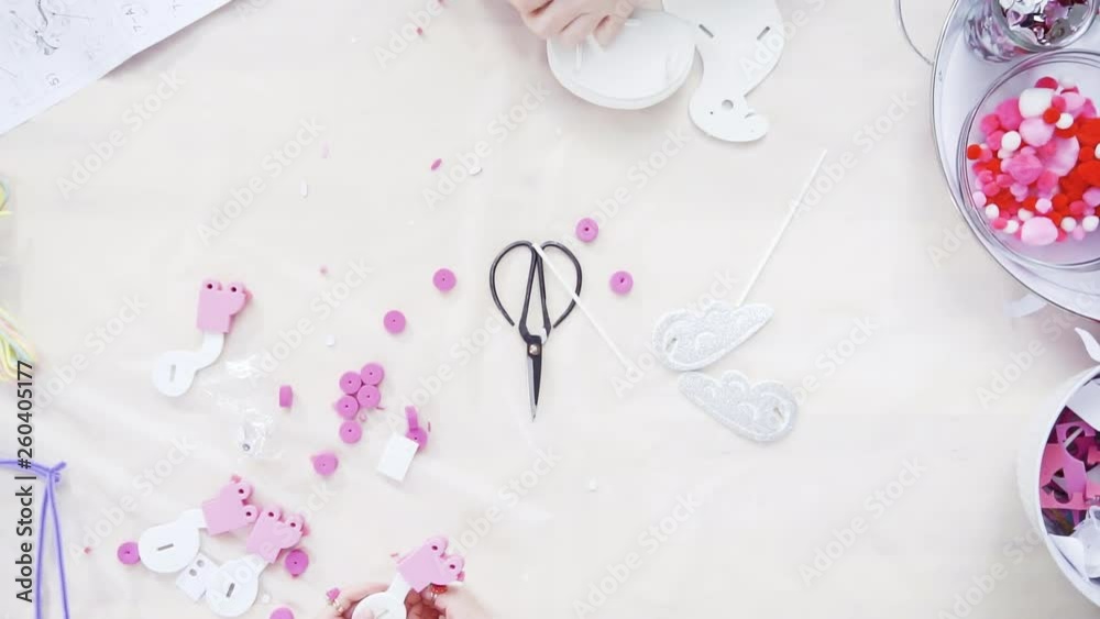 Flat lay. Step by step. Mother and daughter making unicorn craft from paper foam. Flat lay. Step by step. Mother and daughter making unicorn craft from paper foam.