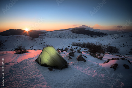 Tent On The Snow Of Winter Landscape At The Sunrise photo