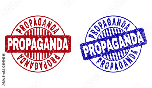 Grunge PROPAGANDA round stamp seals isolated on a white background. Round seals with grunge texture in red and blue colors. Vector rubber imprint of PROPAGANDA caption inside circle form with stripes.