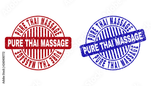 Grunge PURE THAI MASSAGE round stamp seals isolated on a white background. Round seals with grunge texture in red and blue colors.