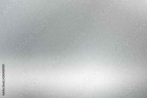 Abstract texture background, light shining on rough silver metallic wall