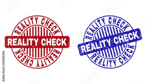 Grunge REALITY CHECK round stamp seals isolated on a white background. Round seals with grunge texture in red and blue colors.