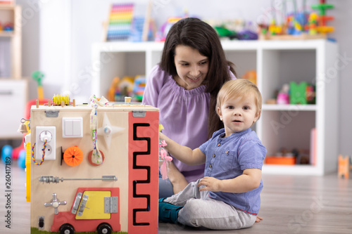 Cute toddler baby playing w...