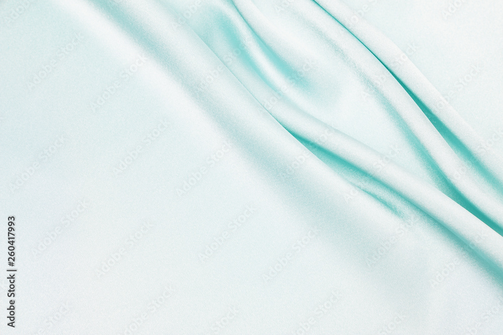 Obraz premium Tekstura satynowej tkaniny w kolorze niebieskim jako tło