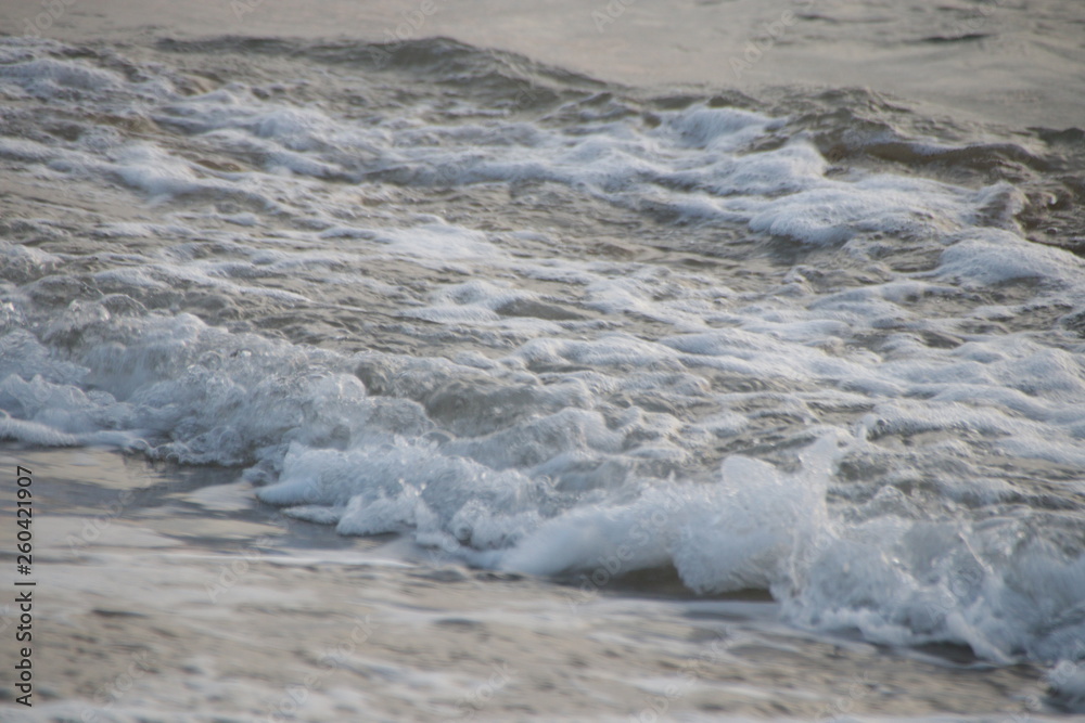 Bubble Foam of the Sea Wave on the Beach and Fine Sand,The Glittering from the Bubbles makes the Precious scenery of the Seashore , peaceful and Tranquility Bubble Foam of the Sea Wave on the Beach and Fine Sand,The Glittering from the Bubbles makes the Precious scenery of the Seashore , peaceful and Tranquility