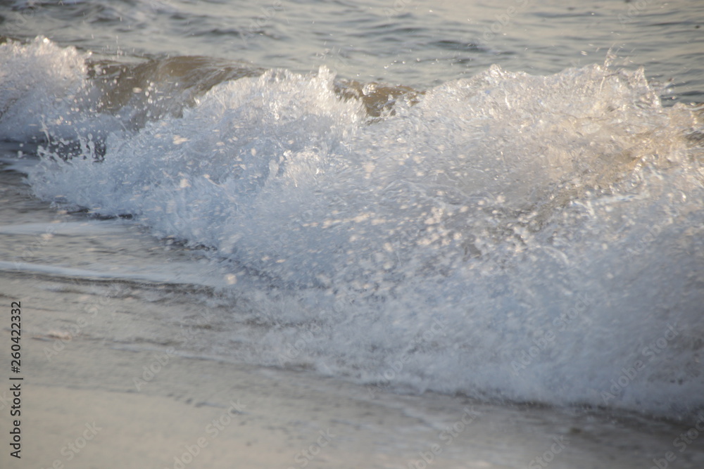 Bubble Foam of the Sea Wave on the Beach and Fine Sand,The Glittering from the Bubbles makes the Precious scenery of the Seashore , peaceful and Tranquility Bubble Foam of the Sea Wave on the Beach and Fine Sand,The Glittering from the Bubbles makes the Precious scenery of the Seashore , peaceful and Tranquility