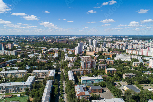Fototapeta Naklejka Na Ścianę i Meble -  Top down aerial drone image of a Ekaterinburg city in the midst of summer, backyard turf grass and trees lush green.