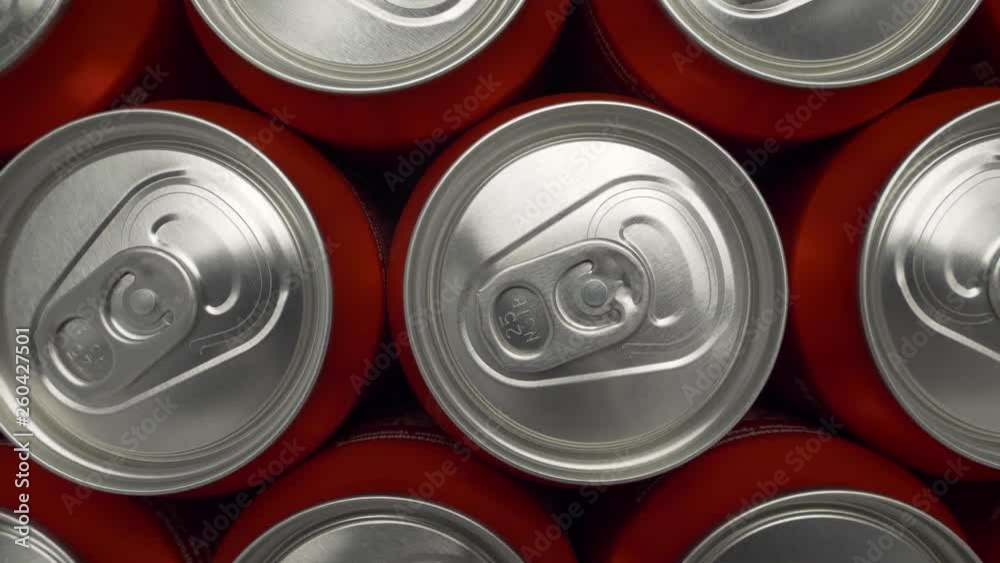 refrigerator clogged with cans of soda. aluminum cans of beverage lie in an filled fridge. Cans with beer on a shelf in the refrigerator. dolly slow motion shot close up medium refrigerator clogged with cans of soda. aluminum cans of beverage lie in an filled fridge. Cans with beer on a shelf in the refrigerator. dolly slow motion shot close up medium