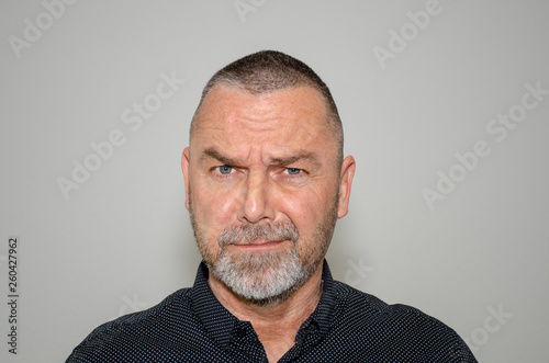 Sceptical bearded man with a quizzical expression