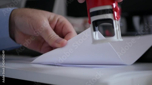 Businessman in Office Room Stamping Official Company Documents and Contracts