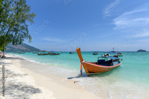 Beautiful crystal tropical sea with wooden boat at lipe © Mumemories