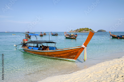 Wooden long-tail boats on tropical sea
