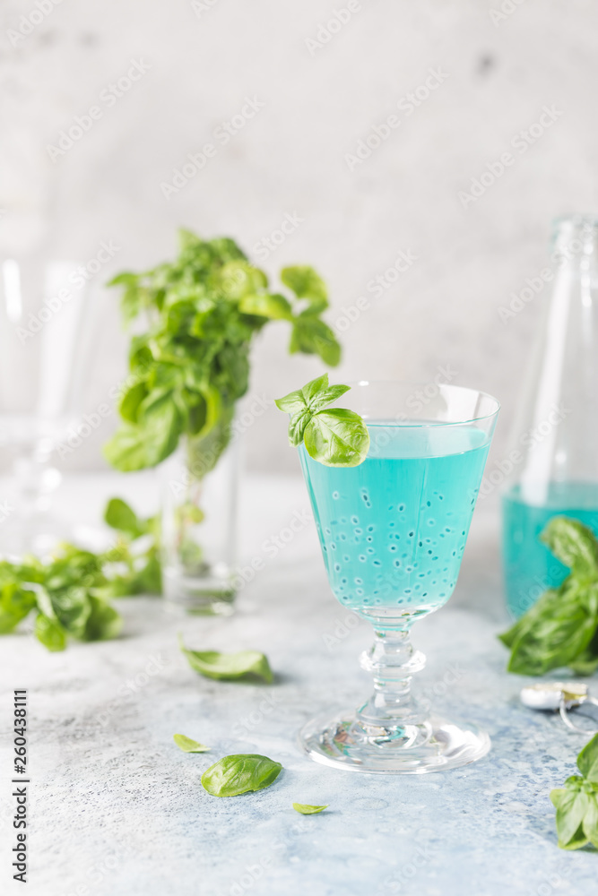 Colorful refreshing summer drink with basil seeds on light background. Colorful refreshing summer drink with basil seeds on light background.