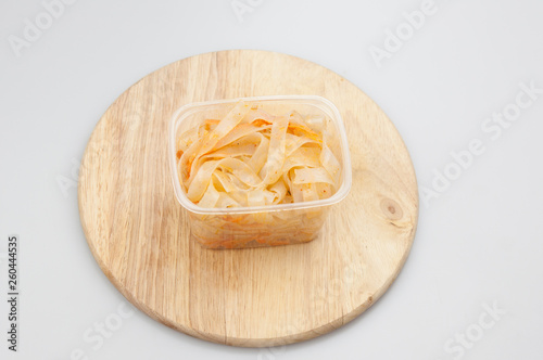 Funchoza salad with rice noodles on white. Copy space