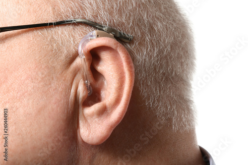 Senior man with hearing aid...