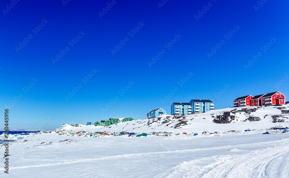 Colorful Inuit houses of Nuuk city with  mountains in the background, Greenland