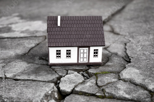 Принти на полотні Model of house on cracked road outdoors. Concept of earthquake