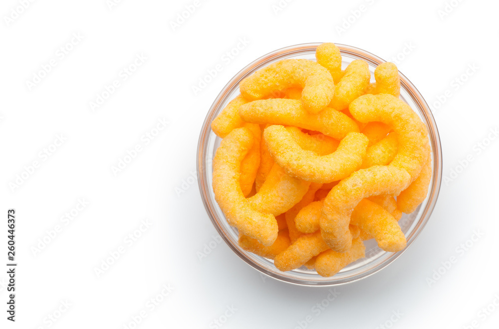Cheese puffs in a glass bowl, Isolated on a white background. Top view. Cheese puffs in a glass bowl, Isolated on a white background. Top view.