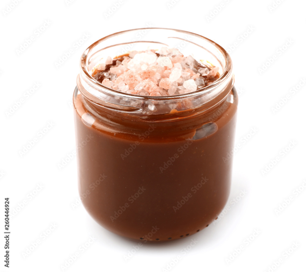 Jar of tasty salted caramel on white background Jar of tasty salted caramel on white background