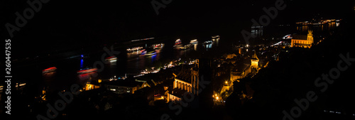 Cruise ships on the Rhine river, at night, in Oberwesel, Germany photo