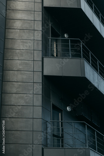 Minimalism in architecture and buildings. The black facade of the house and textures.