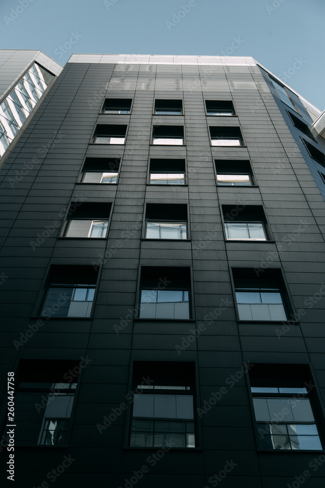 Minimalism in architecture and buildings. The black facade of the house and textures. Minimalism in architecture and buildings. The black facade of the house and textures.