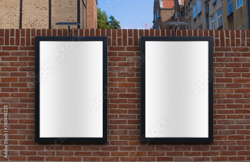 3D rendering of blank billboard (empty advertisement) on brick wall. Empty mockup template
