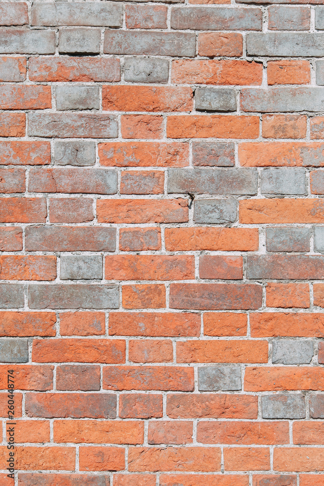 Fototapeta premium Textured wall of the old house. Texture of old brick wall with paint.