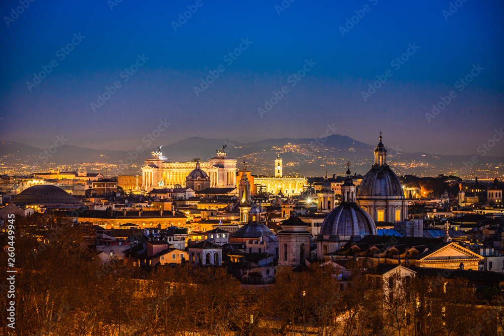 Night cityscape with various landmarks in Rome Italy
