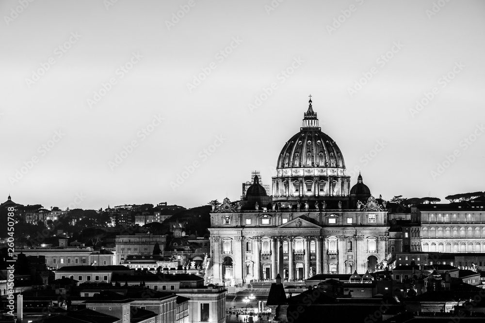 Black and white night view of St. Peter's Basilica in Vatican City, Rome, Italy