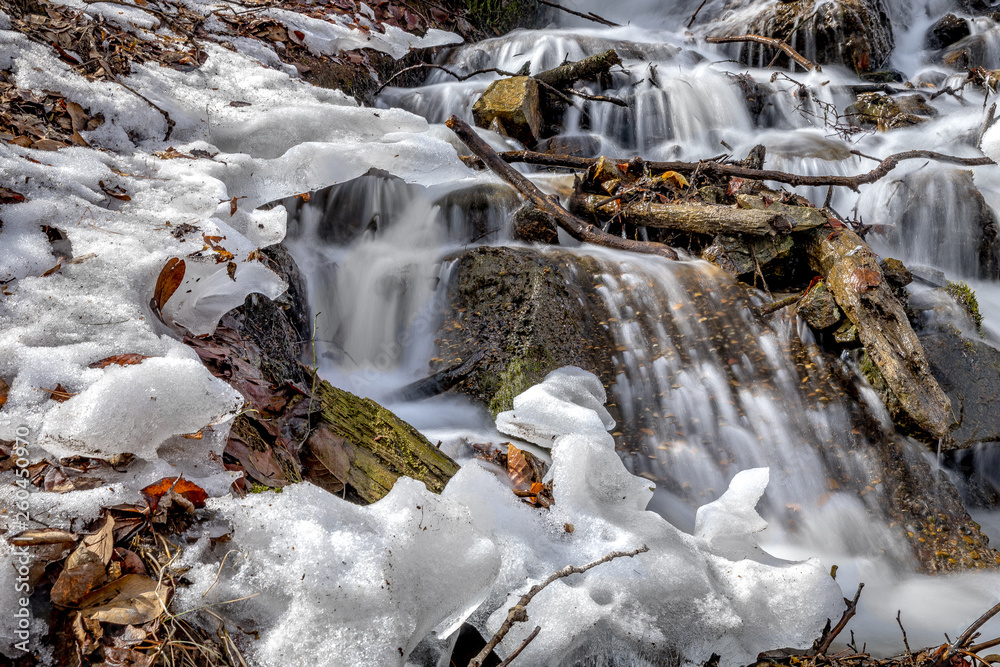 spring waterfall from melting snow in Russia spring waterfall from melting snow in Russia