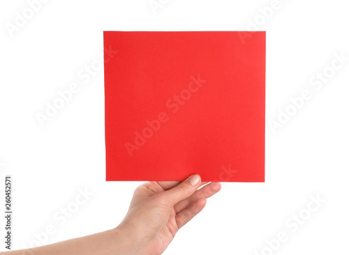 Female hand with blank invitation card on white background
