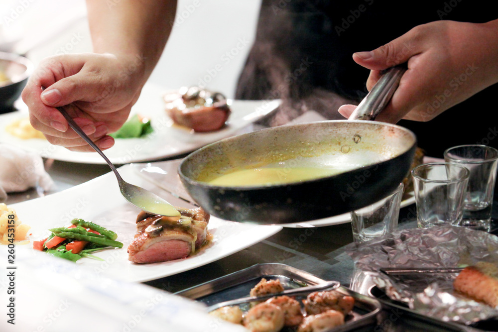 Chef preparing food, meal, in the kitchen, chef cooking, Chef decorating dish Chef preparing food, meal, in the kitchen, chef cooking, Chef decorating dish