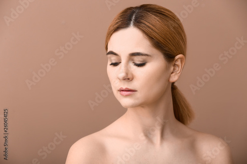 Portrait of beautiful woman on color background