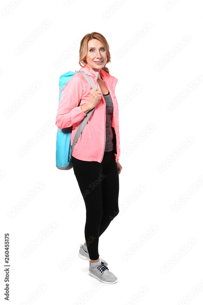 Sporty mature woman with mat on white background Sporty mature woman with mat on white background