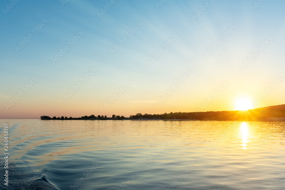 Beautiful sunset view from the water ship. landscape with the concept of travel.