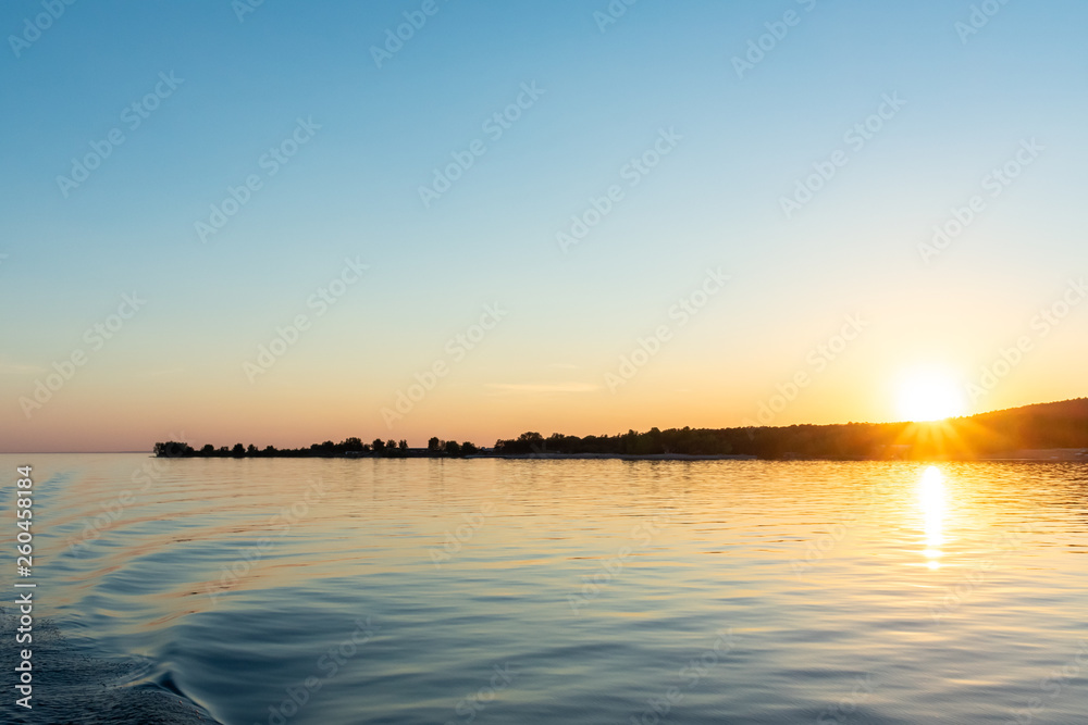 Beautiful sunset view from the water ship. landscape with the concept of travel.