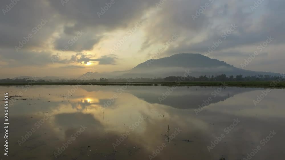 Timelapse beautiful sunrise view in paddy field with reflection Bukit Mertajam. Timelapse beautiful sunrise view in paddy field with reflection Bukit Mertajam.