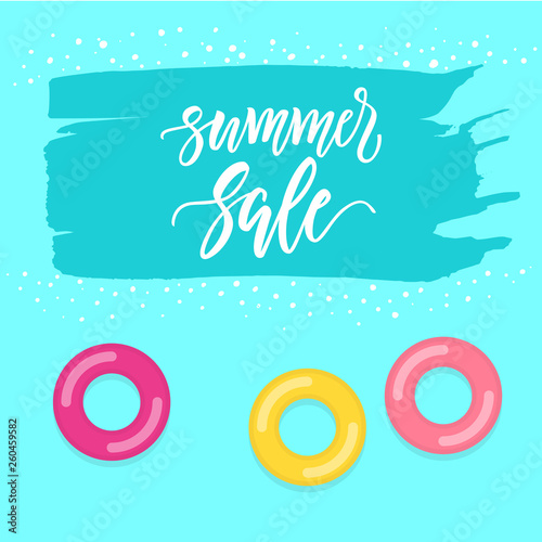 Seasonal SALE design with brush painted copy space and inflatable rings floating on a pool surface.